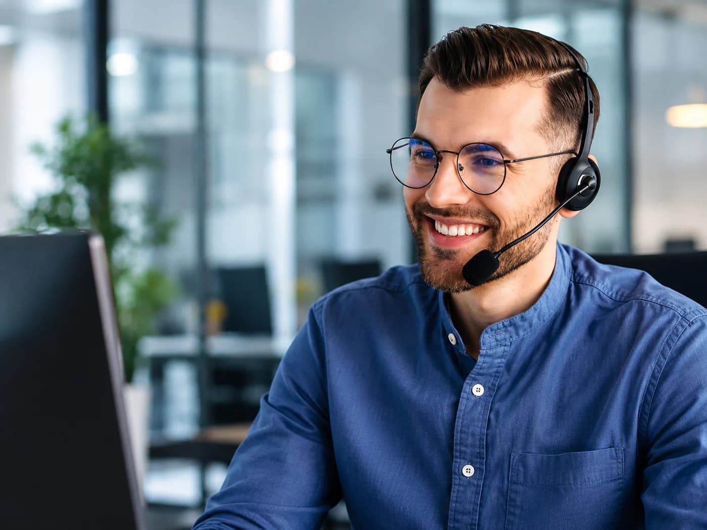 An Appliance Repair Sherwood Park support team member taking a customer call with a headset